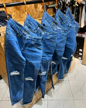 Knee Cut Blue Jeans. Ocean Colour