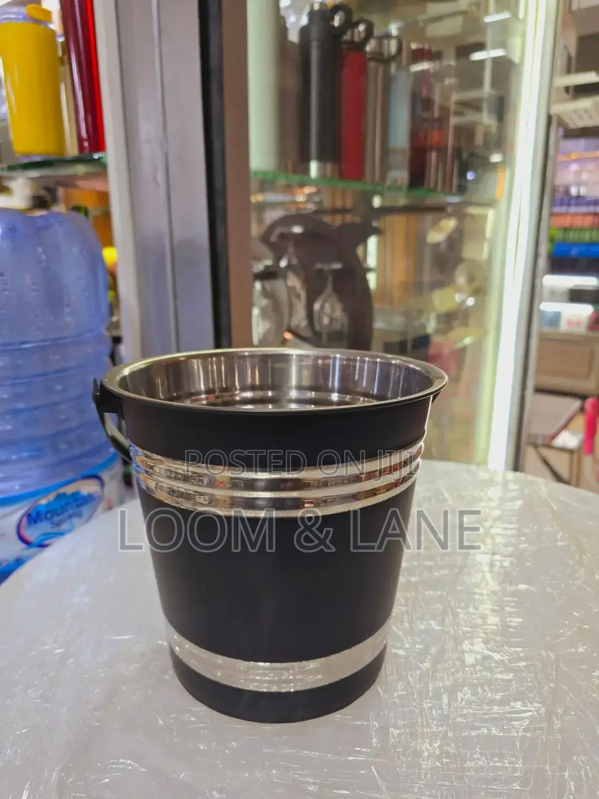 Black and Silver Stainless Ice Bucket With a Handle