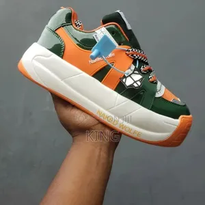 Naked Wolfe Sneakers. Mid Orange