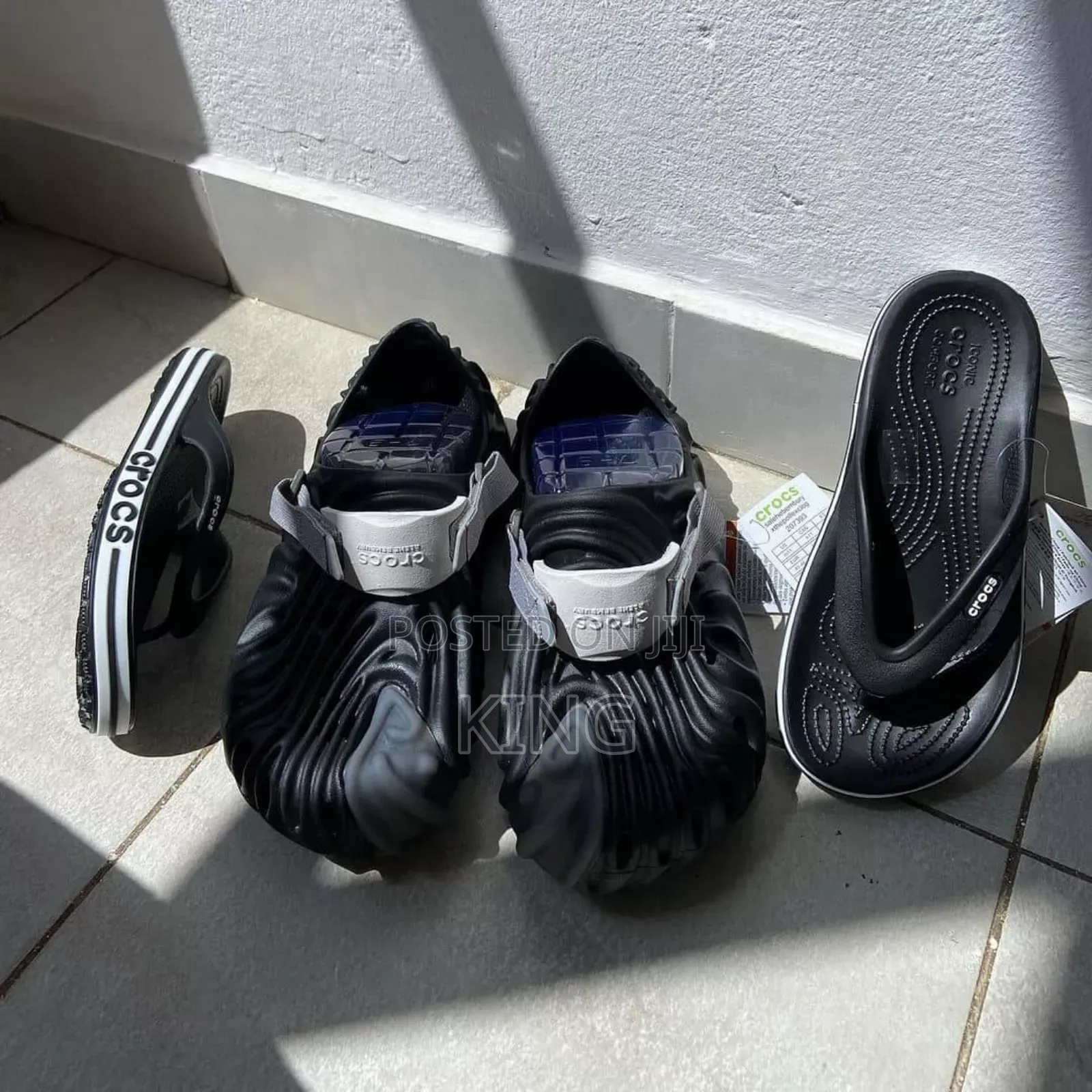 Black Crocs and Flip Flops by Crocs
