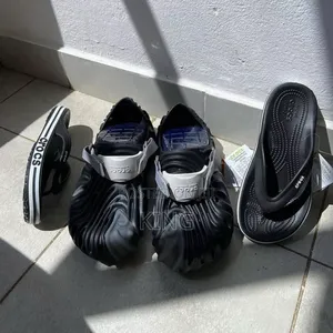 Black Crocs and Flip Flops by Crocs