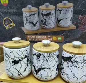 Beautiful Reliable Decor Mable Canisters With a Wooden Base
