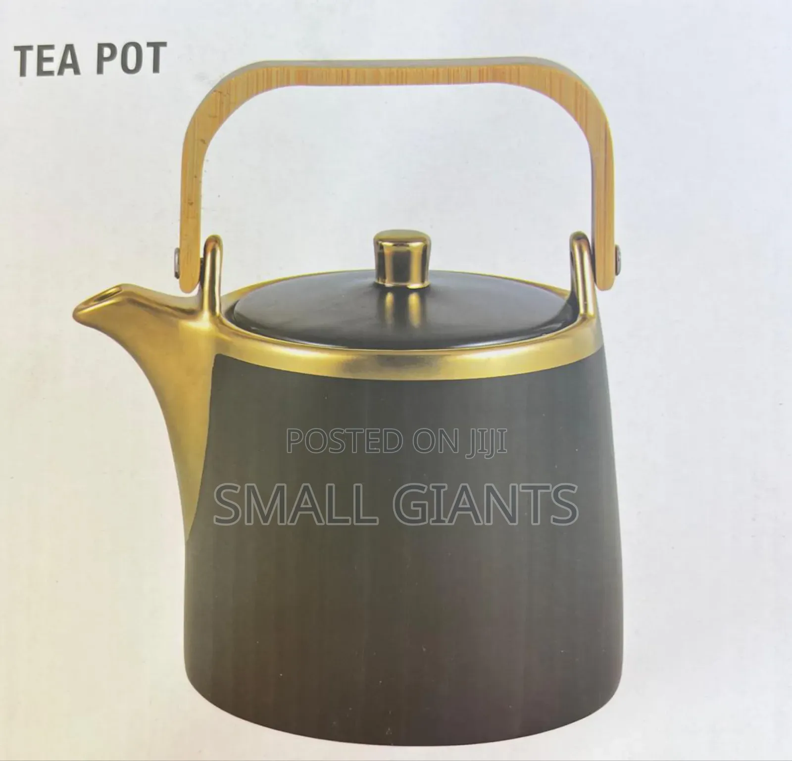 Gold Coated Tea Pot With a Wooden Handle