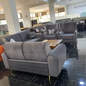 Classy Grey Sofa Made of Good Timber,Having Metallic Stands.