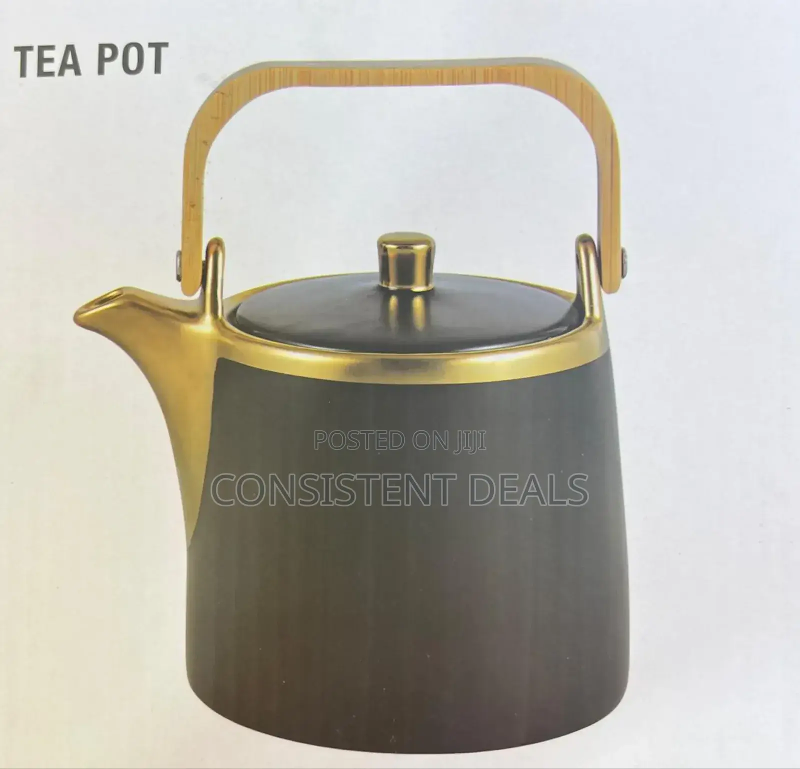 Gold Coated Tea Pot With a Wooden Handle