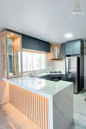 Kitchen Island With Fluted Wall Panels.