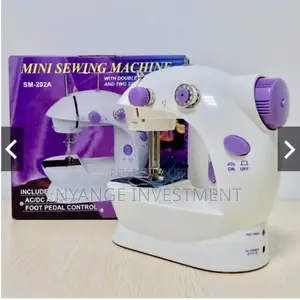 Mini Sewing Machine. Sewing Machine