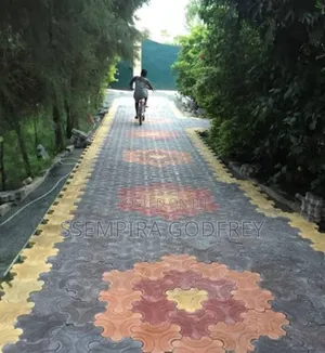 Installation of Coloured Pavers and Structual Land Scape.