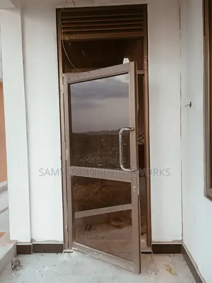 Aluminum Swinging Door Bronze Nansana