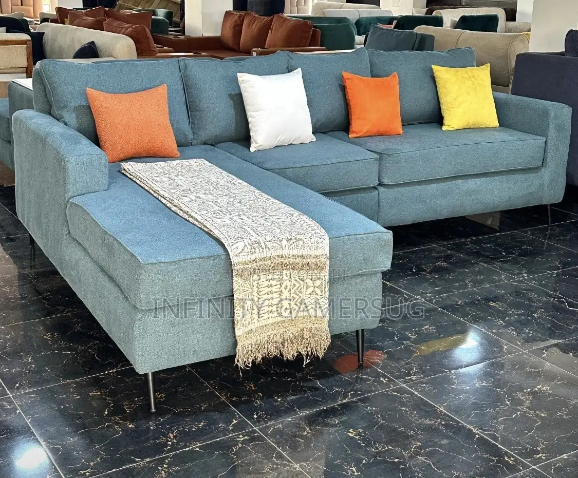 A Modern Unique L Shaped Sofa in Sky Blue.
