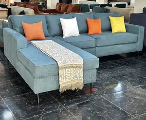 A Modern Unique L Shaped Sofa in Sky Blue.