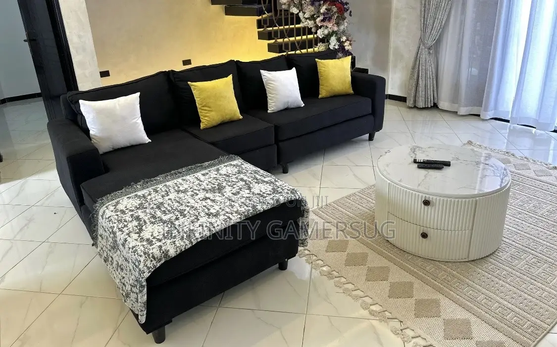 A Classy L Shaped in Black Color With Fiber Pillows.