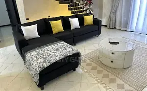 A Classy L Shaped in Black Color With Fiber Pillows.