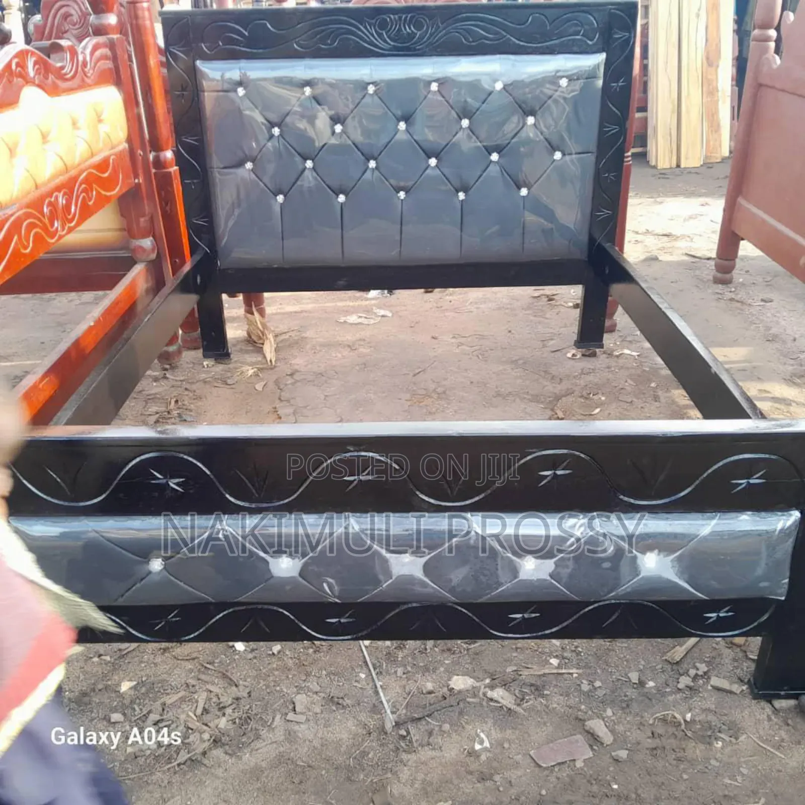 5by6 Gray Leather Bed With a Black Frame