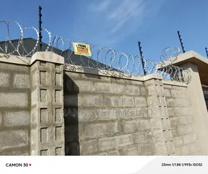Electric Fence With Razor Wire Fence.