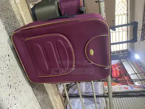 Maroon Cloth Suit Case