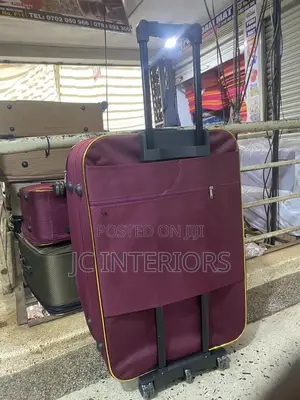 Maroon Cloth Suit Case