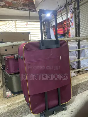 Maroon Cloth Suit Case