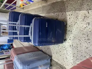 3 Piece Set of Black Suit Cases