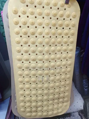 Beige Textured Rubber Bath Mat by Kenney.
