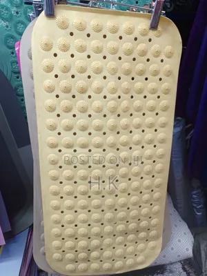 Beige Textured Rubber Bath Mat by Kenney.