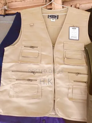 Beige Utility Vest With Multiple Pockets.