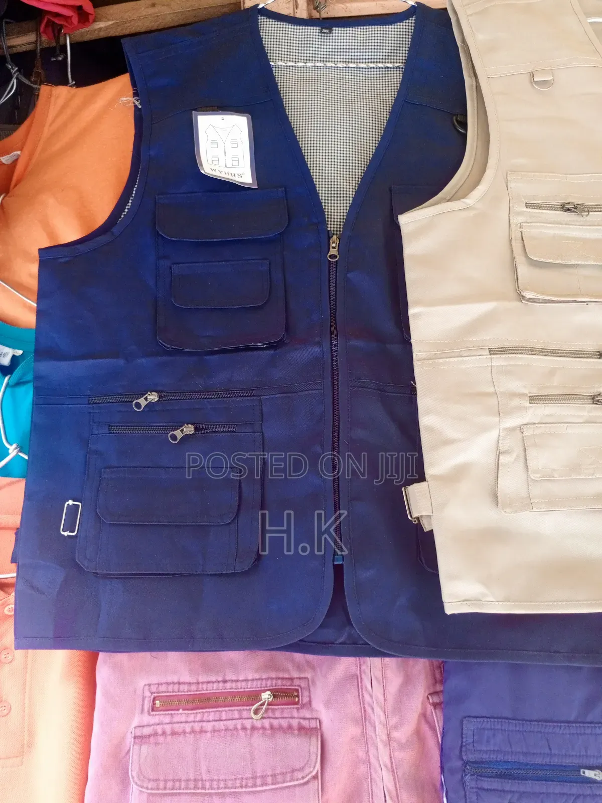 Beige Utility Vest With Multiple Pockets.