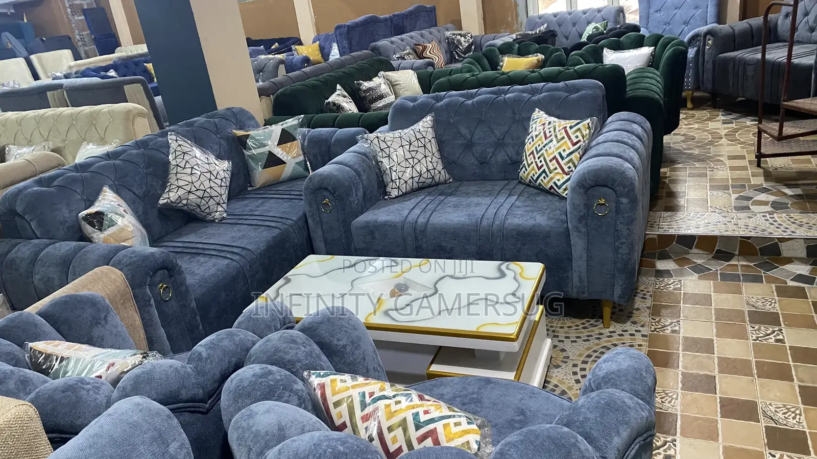 A Chesterfield Sofa in Sky Blue Readily Available.
