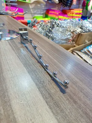 Wall-Mounted Clothes Hanger Rack.