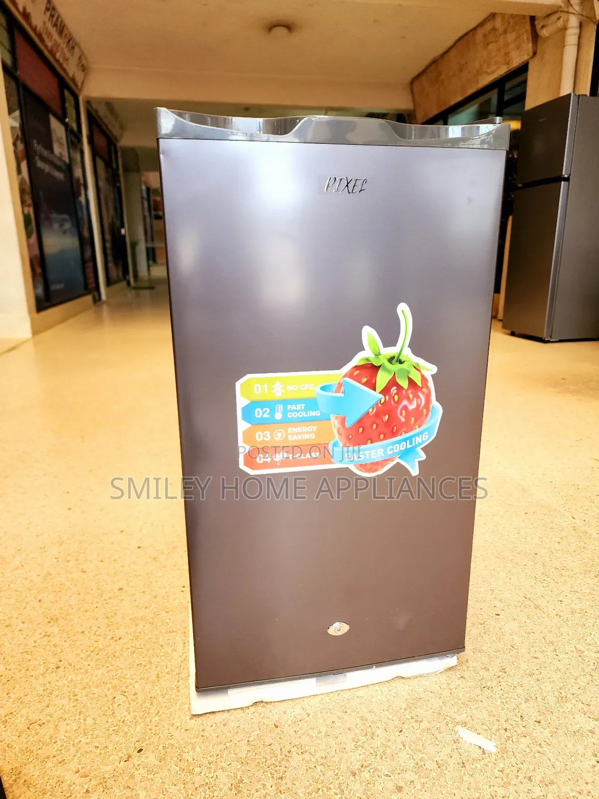 Pixels Single Door Fridge With A Free Power Guard And Stand