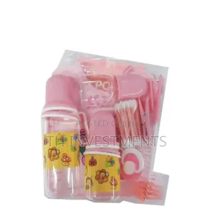 A Set of Three Baby Bottles With Helpers 