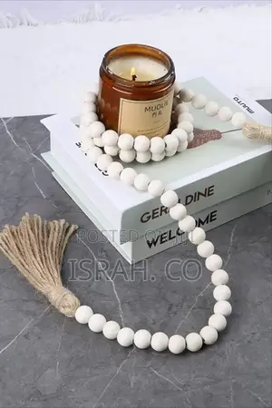 A Decorative Wood Bead Garland With Tassels