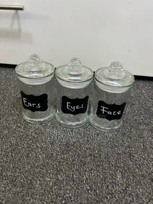 Three Labeled Glass Jars, Likely Used for Storage