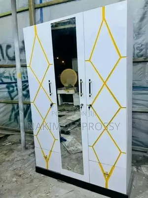 White Wardrobe With Yellow Lined Designs