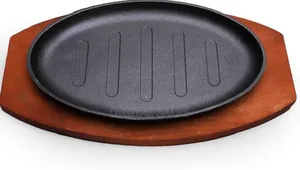 A Set of Two Japanese Sizzling Steak Plates With Wooden Base