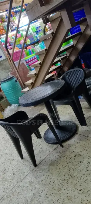 Plastic Sofa Chairs and Round Black Table