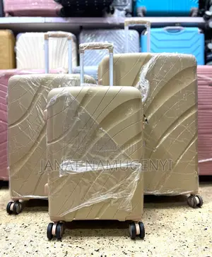 A Set of Cream Rubber Suitcases