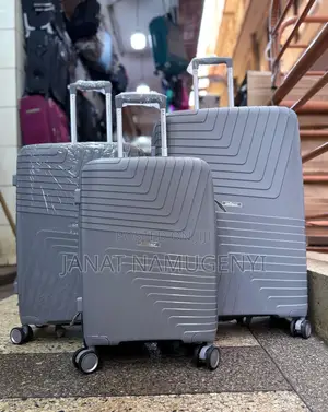 A Set of Shodealy Grey Rubber Suitcases