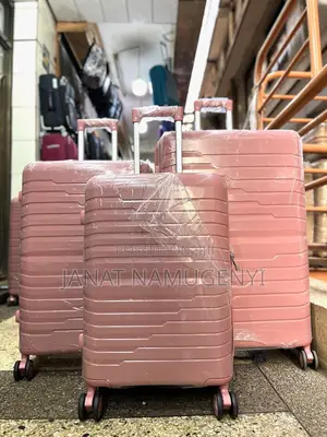 A Set of Peach Rubber Suitcases Available