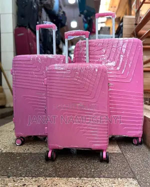 A Set of Shodealy Pink Rubber Suitcases Available