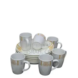 A Set of 6 Ceramic Dinner Plates and 6 Cups