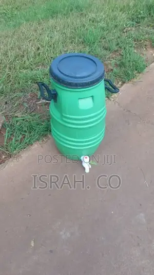 A Plastic Handwashing Water Tank With a Tap.