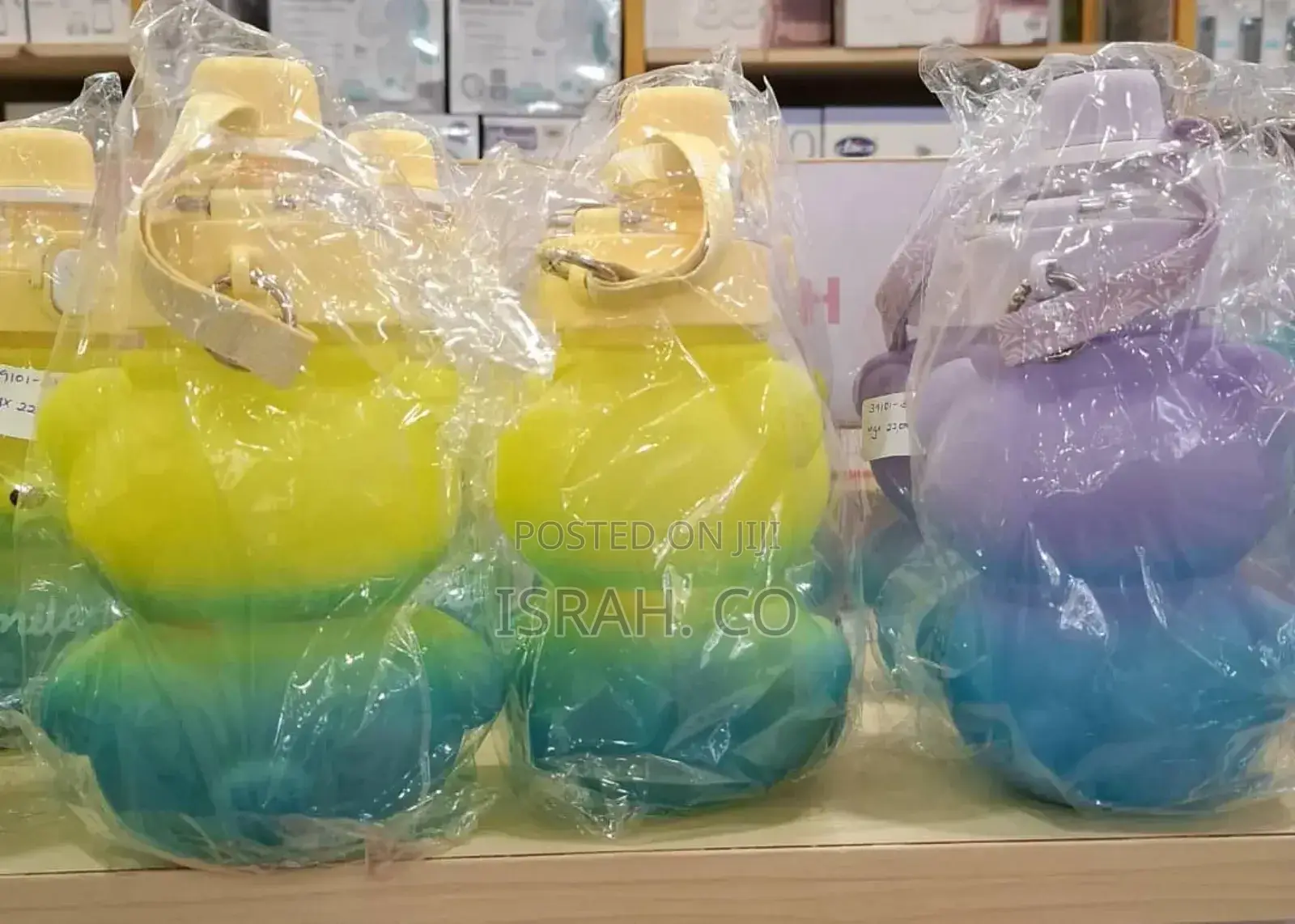 Several Children's Water Bottles Shaped Like Cartoon Bears