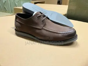 Brown Timberland With a Draw String Closure