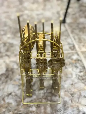 A 24-Piece Gold Cutlery Set With a Stand