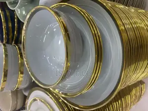 Stack of Dinnerware,Plates and Bowls, With a Gold