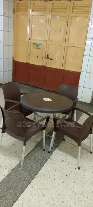 A Set of 4 Plastic Chairs and Table Set