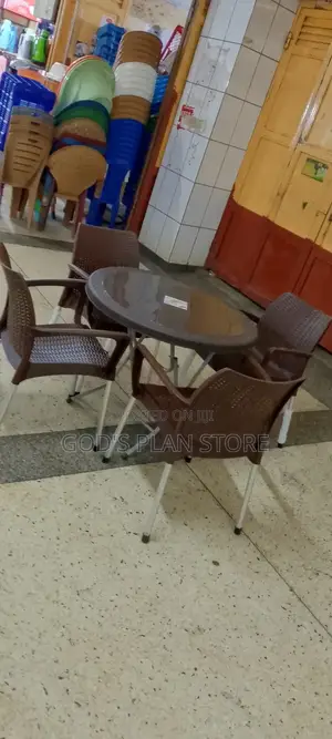 A Set of 4 Plastic Chairs and Table Set