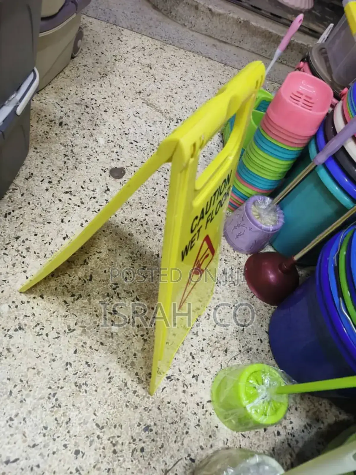 Yellow, Foldable "Caution Wet Floor" Sign.