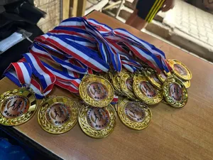 Gold-Colored Medals With Ribbons.